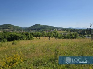 A sunlit land parcel offering panoramic views in a stunning natural setting, with a registered area of 17,880 m², located near the center of the Rakovica settlement, Ilidža